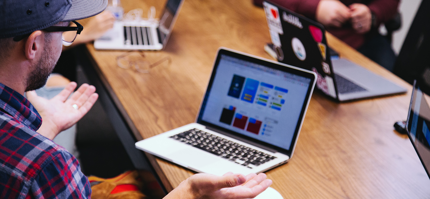 group of people at a creative meeting with laptops