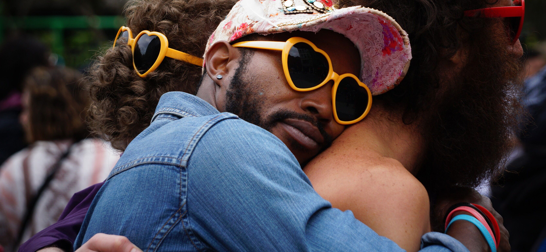 two men hugging at pride