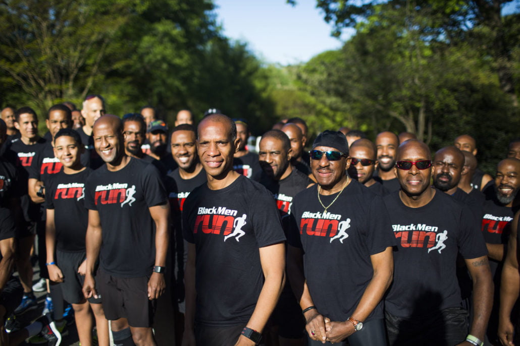 black men run large group photo