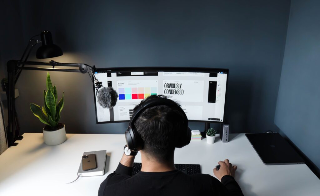 man at computer working on brand guidelines